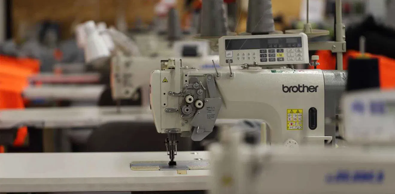 Rainwolf Sports production floor in Sialkot — combat sports equipment manufacturing